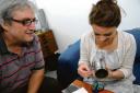 Seeing the light – Alan Hockett with reporter Hannah Marsh and a tin can transformed into a pinhole camera