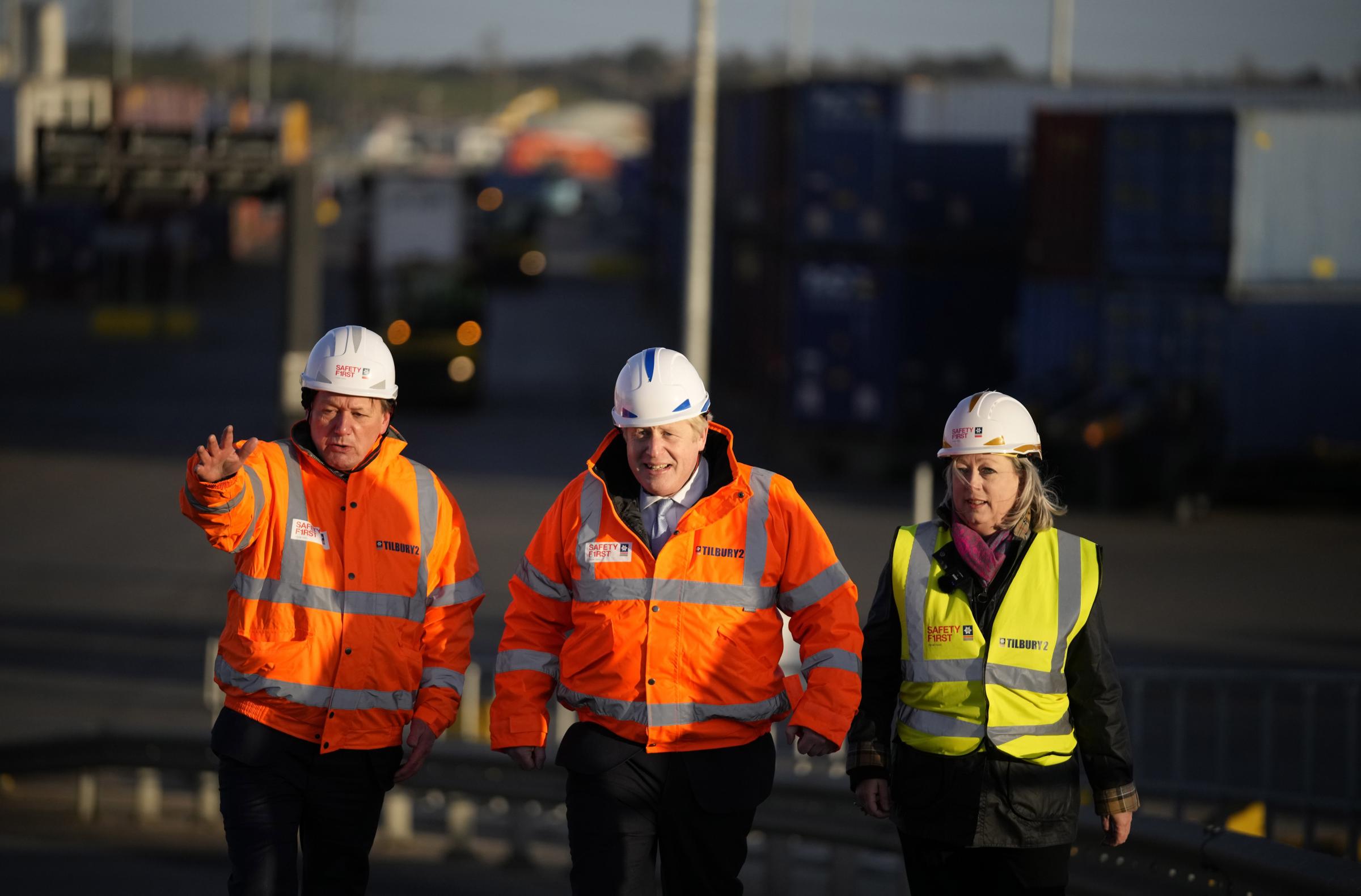 British Prime Minister Boris Johnson (centre)walks with Charles Hammond, Group CEO Forth Ports (right) and British MP Jackie Doyle Price during a visit to the Tilbury Docks in Essex. Picture date: Monday January 31, 2022.