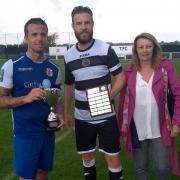 Honours even - Grays Athletic captain Lewis Dark and Tilbury skipper John Easterford with the Stan Veness Trophy