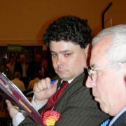 KEEPING TALLY: Labour leader councillor John Kent, who was to retain his own seat, looks nervous as he joins Conservative councillor Eddie Hardiman in keeping a check on the voting.