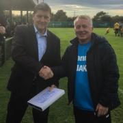 All smiles - John Coventry is presented with a silver salver by East Thurrock owner Benny Bennett