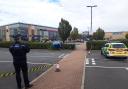 Man held on suspicion of attempted murder after car's driven at group at night hotspot