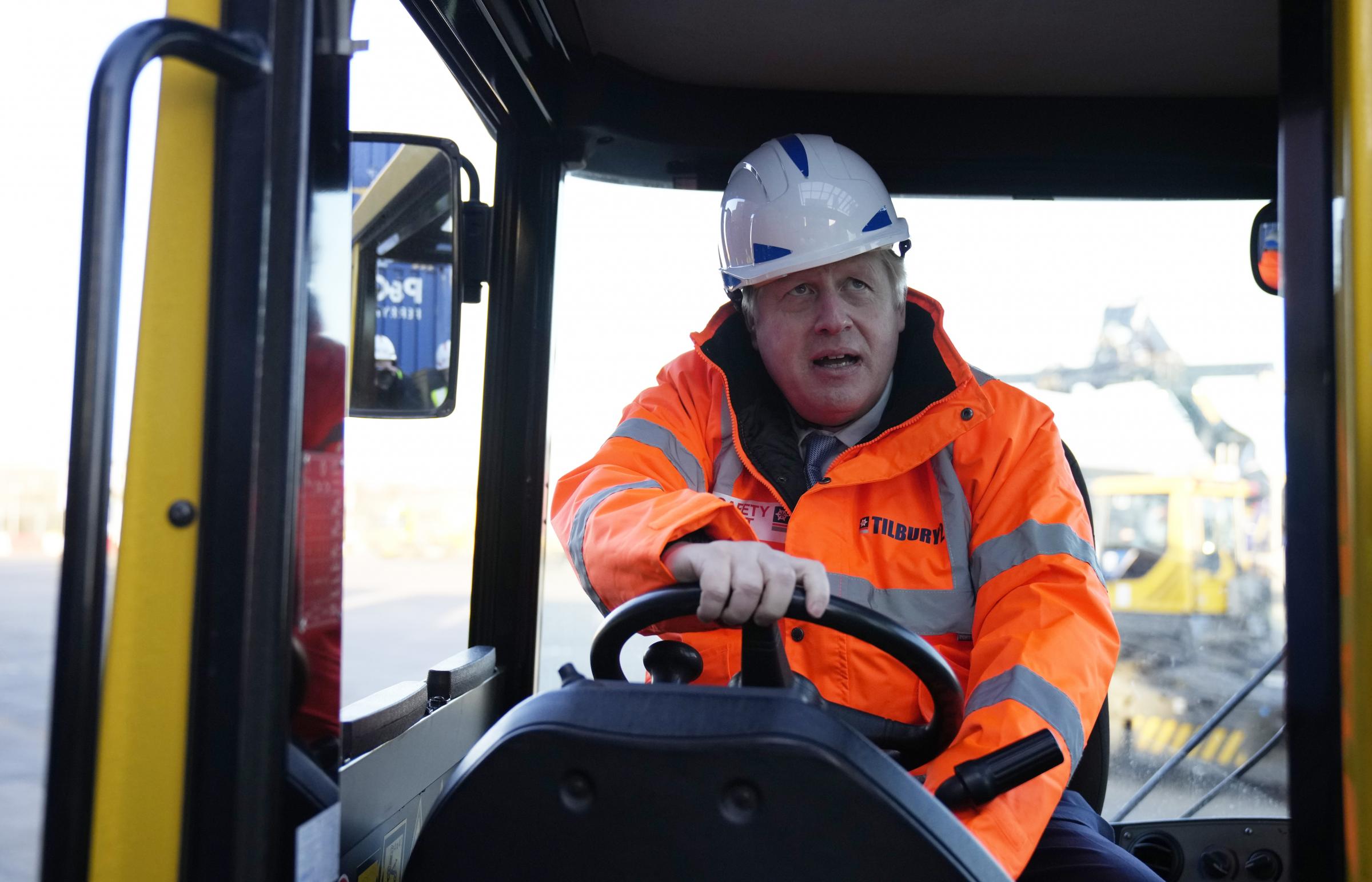 Prime Minister Boris Johnson drives a forklift as he visits the Tilbury Docks in Essex. Picture date: Monday January 31, 2022.