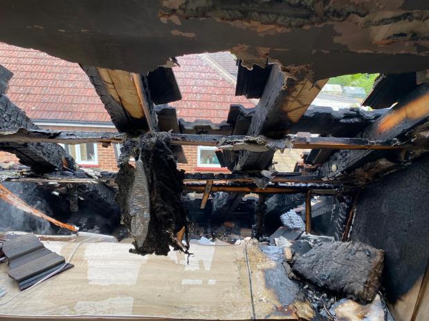 Thurrock Gazette: The roof of the bungalow was singed in the aftermath