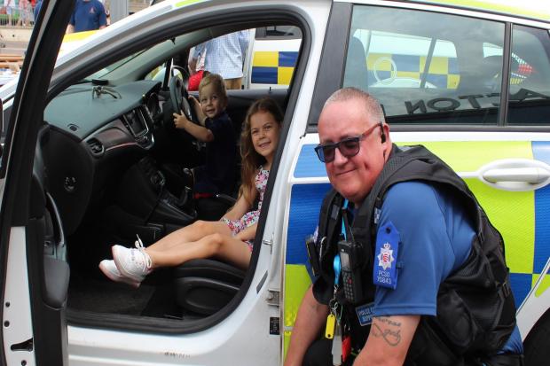 Driving seat: Cayson and Halle Wheldon-Mace with PCSO Paul Brassey