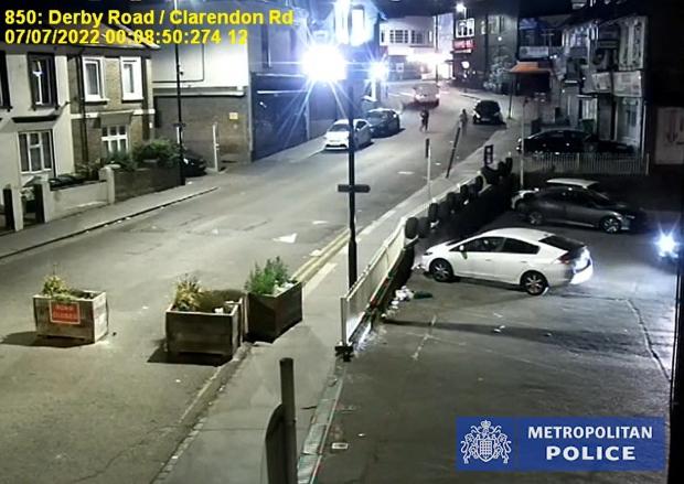 Thurrock Gazette: CCTV of of Owami Davies crossing Derby Road, West Croydon in the company of a man in front of a white van. Photo: Metropolitan Police / PA Wire