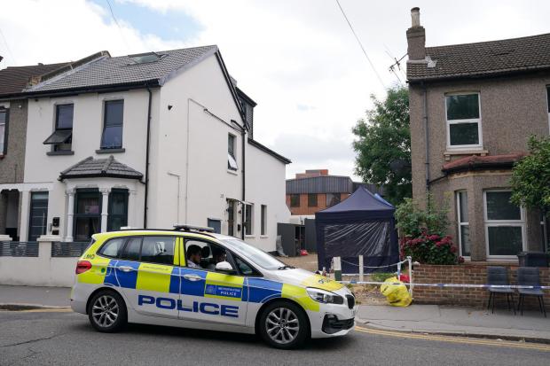 Thurrock Gazette: Police outside a property on Derby Road, West Croydon. Photo: Metropolitan Police / PA Wire