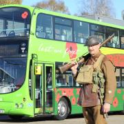 Eye-popping - First Essex's Remembrance bus with actor Jim Williams. Photo by Richard Keil.