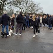Parents wait anxiously outside Ortu Gable Hall School as police were called in to a hoax threat.