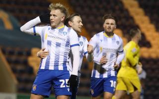 Listen up - Joe Taylor celebrates scoring Colchester United's opener in their 2-1 win over Salford City